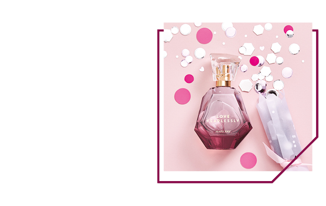 Het Mary Kay-parfum Love Fearlessly ligt op een met confetti bestrooide achtergrond.