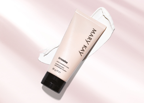 Het Mary Kay TimeWise® Even Complexion Mask voor vale, vermoeid uitziende huid ligt voor een roze achtergrond.